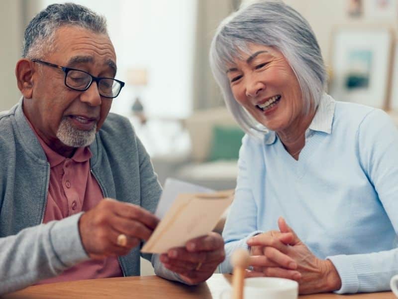 senior housing consultation between older adults reviewing options and making informed care decisions